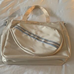 Elegant Cream Tennis Bag with Blue and Gold Accents